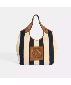 کیف دوشی پارچه راه‎راه لوگو‎دار سرمه ای زنانه برند Desa کد 1753348343