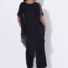 مدل زنانه بزرگ سایز، رنگ سیاه، تکپاره، پارچه جارس، بالای شفاف، با جزئیات روی شانه، و شلوار گشاد مجلسی. برند Şans - 963351809