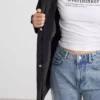بارانی زنانه چرمنما با کلاهدار و سایز بزرگ مشکی برند LC Waikiki - 982324868