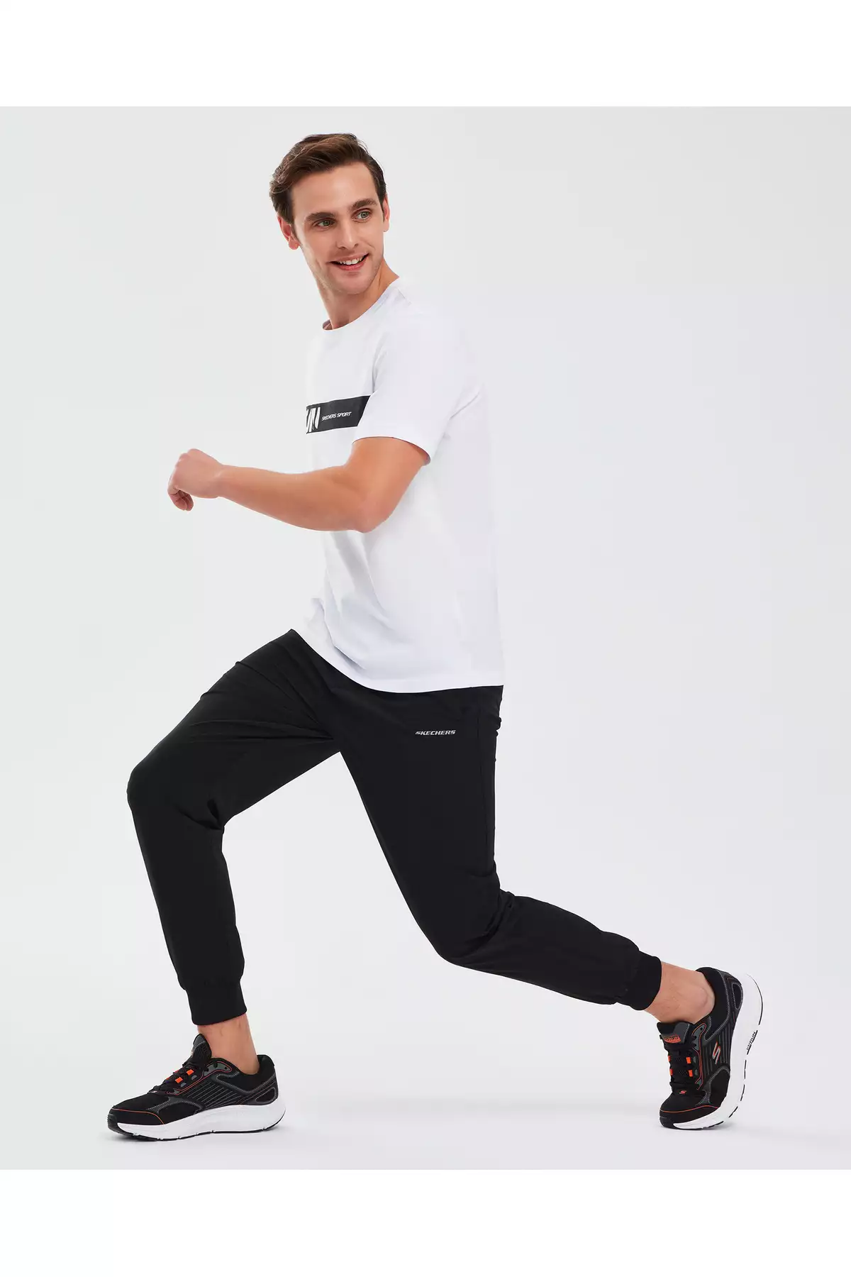 شلوار جوجینگ مردانه مایکرو کالکشن با زیپ کناری - مشکی S211809-001 برند Skechers - 98106288