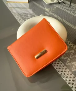 کیف پول نارنجی کوچک با چندین بخش و جزئیات طلایی برند ilknurbutik - 883937990