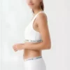 ست نیم تنه ورزشی و شورت زنانه - رنگ سفید، ست راحت و پنبهای برند U.S. Polo Assn. - 960104911