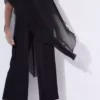 مدل زنانه بزرگ سایز، رنگ سیاه، تکپاره، پارچه جارس، بالای شفاف، با جزئیات روی شانه، و شلوار گشاد مجلسی. برند Şans - 963351809