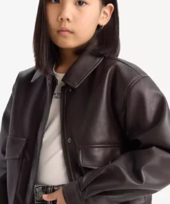 کاپشن چرم مصنوعی دکمهدار ضد آب با دو جیب برای دختران بچه برند Defacto - 899916450